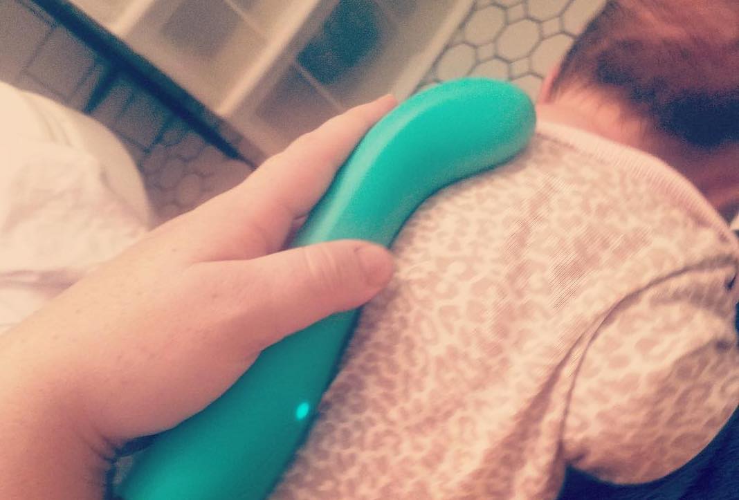 Baby sucking on moms vibrator