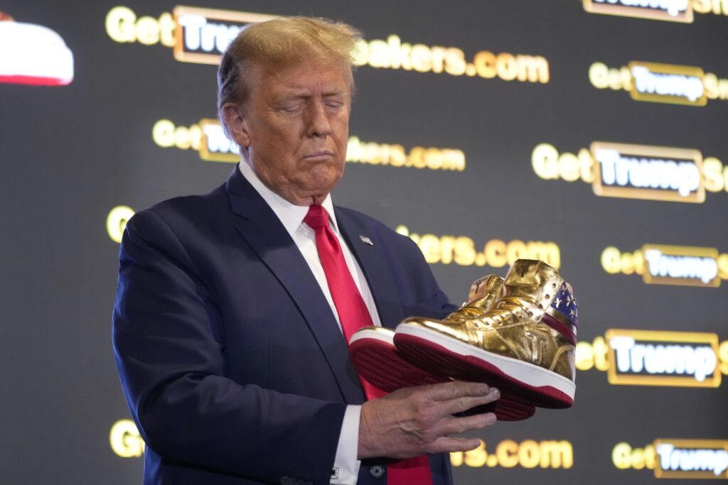 A day after the huge fine, Trump launched his own sneakers bearing the slogan “Never Give Up.”