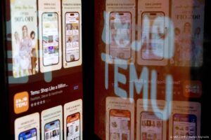 This photo illustration shows the Temu app in the App Store reflected in the company’s logo in Washington, DC, on February 23, 2023. 
Stefani Reynolds / AFP