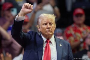 epa11489843 Republican presidential nominee Donald J. Trump holds his fist up after speaking at his first joint rally with Republican vice presidential nominee Senator JD Vance at Van Andel Arena in Grand Rapids, Michigan, USA, 20 July 2024.  EPA/ALLISON DINNER