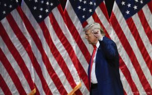 Former US President and Republican presidential candidate Donald Trump raises his fist as he leaves after speaking during a campaign rally at Harrah's Cherokee Center in Asheville, North Carolina, August 14, 2024. 
Peter Zay / AFP