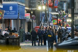 FBI investigators arrive at the scene where the white Ford F-150 pickup truck that crashed into a work lift after allegedly driving into a crowd of New Year's revelers in the French Quarter of New Orleans, Louisiana, on January 1, 2025. At least 10 people were killed and 30 injured Wednesday when a vehicle plowed overnight into a New year's crowd in the heart of the thriving New Orleans tourist district, authorities in the southern US city said.
Matthew HINTON / AFP